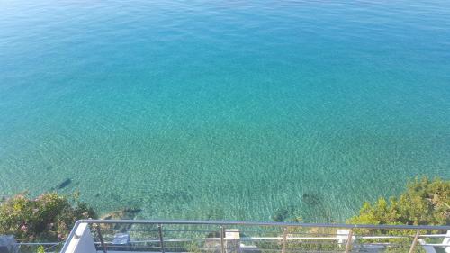 a view of a body of water from a balcony at Villa Lori in Qeparo
