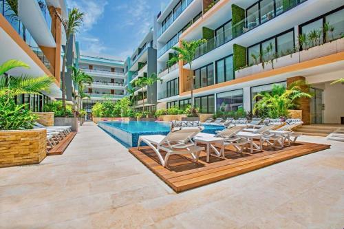an image of a swimming pool at a hotel at Menesse the City by Casago in Playa del Carmen