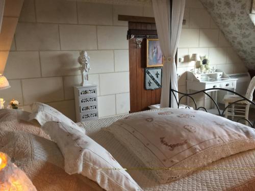 a bedroom with a bed with a canopy at Les charmes in Valençay
