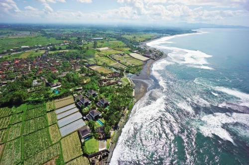 an aerial view of the ocean and a beach at Villa Samudra Luxury Beachfront in Ketewel