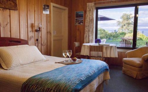 Łóżko lub łóżka w pokoju w obiekcie Hosteria de la Colina