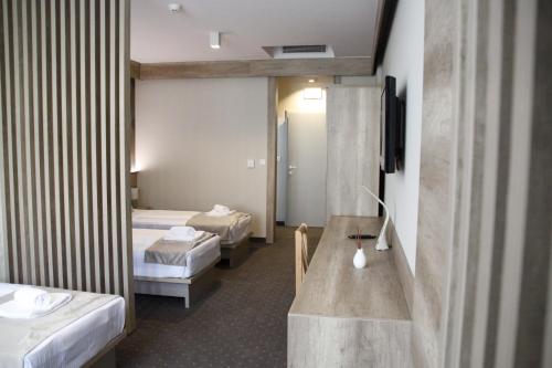 Una cama o camas en una habitación de Student Hotel Mostar
