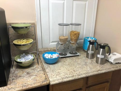a kitchen counter with various food items on it at Mayfair Motel in Cross Keys