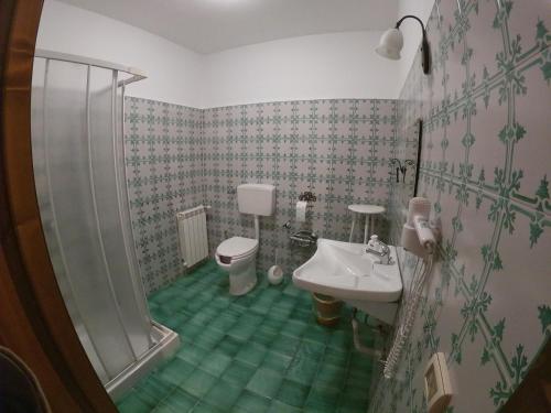 a bathroom with a shower and a toilet and a sink at SESIMA turismo rurale in Mistretta