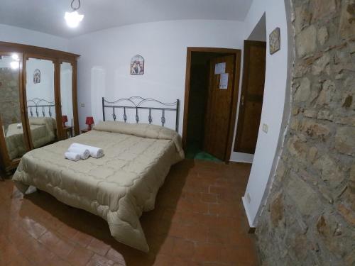 a bedroom with a bed with two towels on it at SESIMA turismo rurale in Mistretta