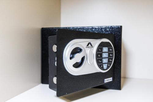 a black and white toaster on a wall at Hotel Tierra Gaucha in San Carlos de Bariloche