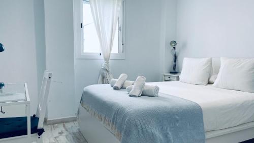 CLB F. Rubio Apartment tesisinde bir odada yatak veya yataklar