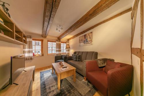 a living room with a couch and a table at Villa-Duck-Dich 27 in Wernigerode