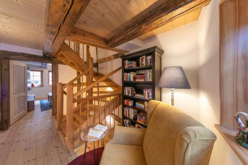 a living room with a couch and a book shelf at Villa-Duck-Dich 27 in Wernigerode