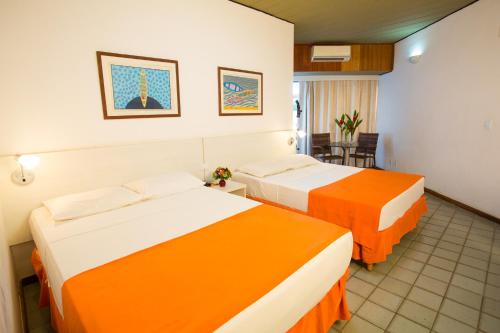 Postel nebo postele na pokoji v ubytování Monte Pascoal Praia Hotel