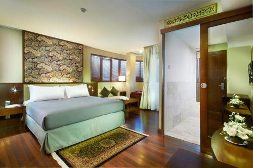 Säng eller sängar i ett rum på House Sangkuriang