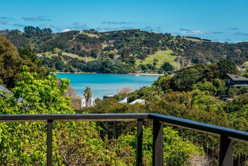 a view of a lake from a balcony at Te Kohanga, Oneroa in Oneroa