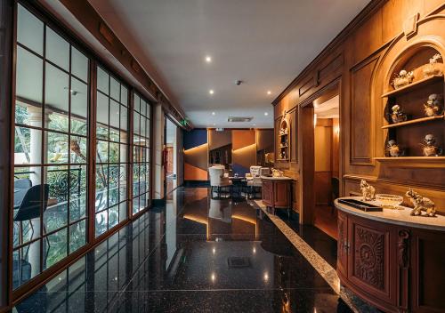 a large room with a large window and a kitchen at Luxva Hotel Boutique in Guayaquil