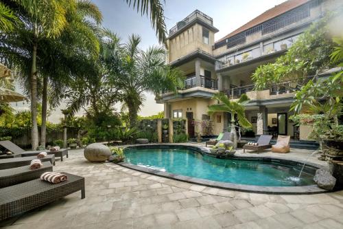 an exterior view of a house with a swimming pool at Uma Dana Ubud in Ubud