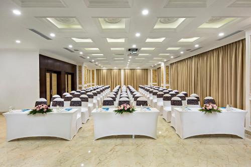 a row of tables with chairs in a banquet hall at Eden Ocean View Hotel Da Nang in Da Nang