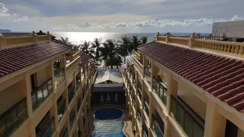 an aerial view of a resort with a swimming pool between two buildings at Golden Phoenix Hotel Boracay in Boracay