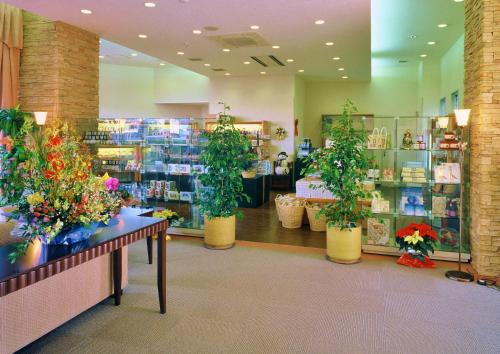 a flower shop with potted plants on display at Hotel Hakuba in Hakuba