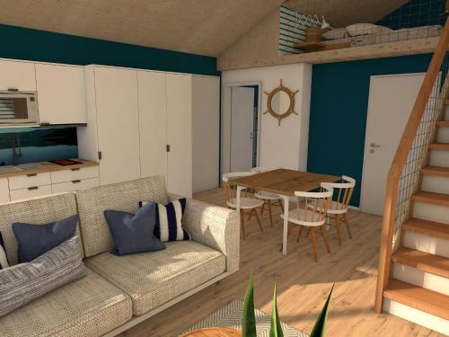 a living room with a couch and a table at Ferienhäuser Saalemaxx in Rudolstadt
