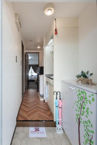 a hallway leading to a kitchen with a hallway leading to a house at Cozy house 31, free wifi a rented electric bicycle in Kyoto