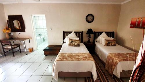 Ένα ή περισσότερα κρεβάτια σε δωμάτιο στο Dei Gratia Guest House