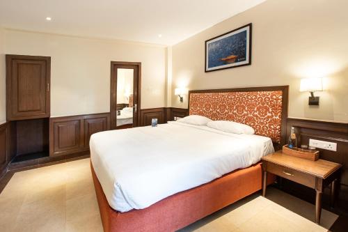 Een bed of bedden in een kamer bij Hotel Raindrops