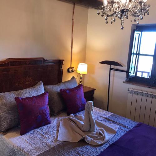a bedroom with a bed with a blanket on it at Los Balcones de Nieda in Cangas de Onís