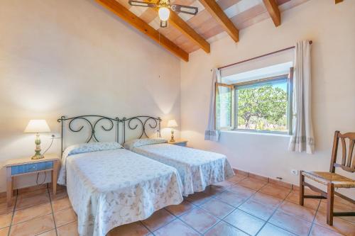 Ένα ή περισσότερα κρεβάτια σε δωμάτιο στο Finca Sa Casa Nova
