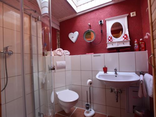 a bathroom with a toilet and a sink at Wohnung in Ribnitz Damgarten in Ribnitz-Damgarten