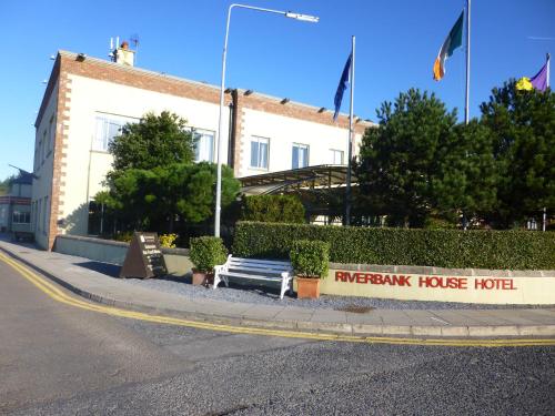 a bench sitting on the side of a building at Riverbank House Hotel in Wexford