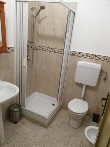 a bathroom with a toilet, sink, and shower at I Cavalieri di Malta in Palermo