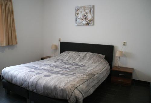 Ένα ή περισσότερα κρεβάτια σε δωμάτιο στο erve Hanebulten