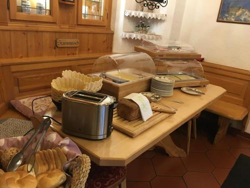 a table with bread and other items on it at Landgasthof Neuwirt in Lofer