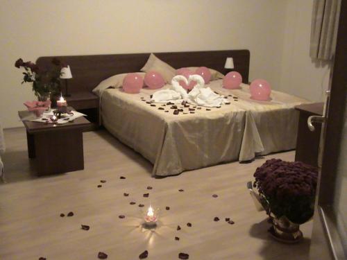 a bedroom with a bed with a lot of debris on the floor at Persey Flora Apartments in Borovets