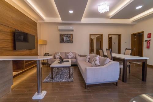 a living room with a couch and a table at Belad Bont Resort in Salalah