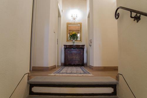 a hallway with a table and a dresser in a room at AGRITURISMO Ca' Maggio in Sassofeltrio