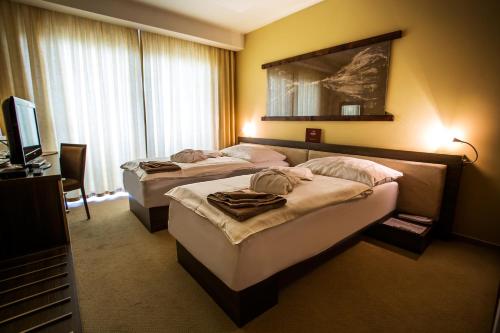 Posteľ alebo postele v izbe v ubytovaní Wellness Hotel Diplomat
