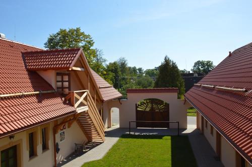 a view of the courtyard of a house with red roofs at Penzion U podkováře in Třeboň