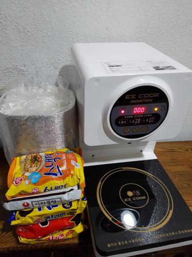 a toaster oven with a box of chips next to it at Seong Dong Jang in Daegu