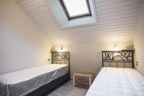 Un pat sau paturi într-o cameră la Cesa Civetta