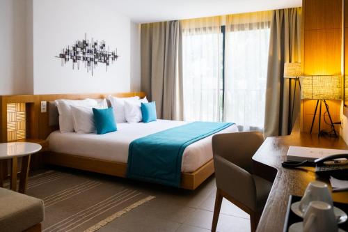 Letto o letti in una camera di Les Orangers Garden Villas and Bungalows Ultra All inclusive