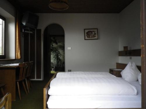 Ein Bett oder Betten in einem Zimmer der Unterkunft Pension Rainhof