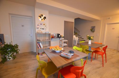a living room with a table and chairs at La Casa Di Alice in Rodello
