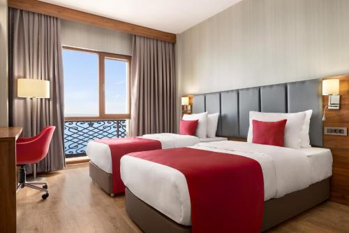 Postel nebo postele na pokoji v ubytování Ramada by Wyndham Van