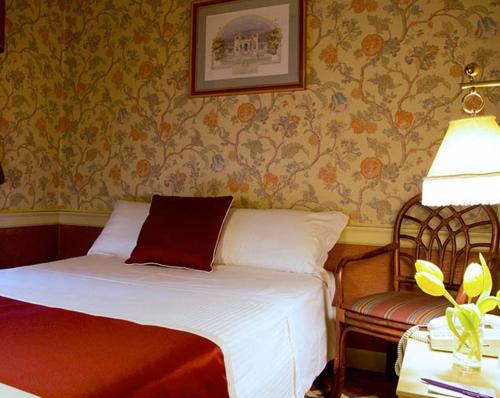 Ένα ή περισσότερα κρεβάτια σε δωμάτιο στο Hotel Milano Regency