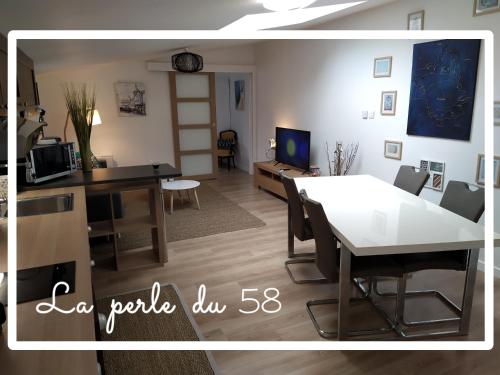a living room with a table and a dining room at La perle du 58 - T2 Parking Wifi Terrasse CLIM in Rodez