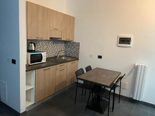 A kitchen or kitchenette at BICOCCA APPARTAMENTI