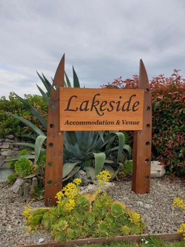 a sign for a landscaped garden in a garden at Accommodation at Lakeside in Oamaru