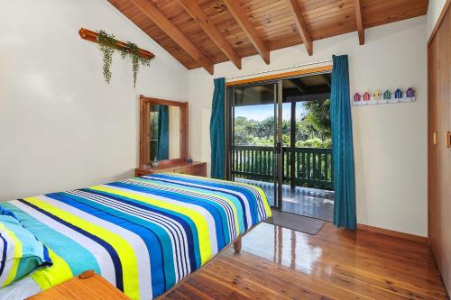 Ένα ή περισσότερα κρεβάτια σε δωμάτιο στο 112 Mooloomba Road