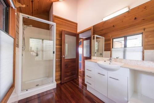 a bathroom with a sink and a shower at 52 Tramican Street in Point Lookout