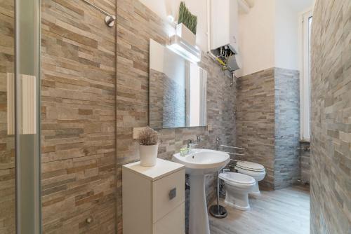 a bathroom with a sink and a toilet at CS Piazza Venezia Apartment in Rome